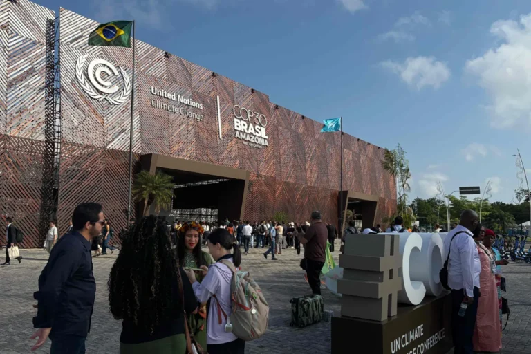 112974369-attendees-walk-in-front-of-the-main-entrance-to-the-cop30-un-climate-change-conference-in.webp