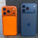 Apple iPhone 17 Pro in Cosmic Orange next to the iPhone 17 Pro Max in Deep Blue