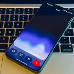 Gemini Live on a phone atop a keyboard.